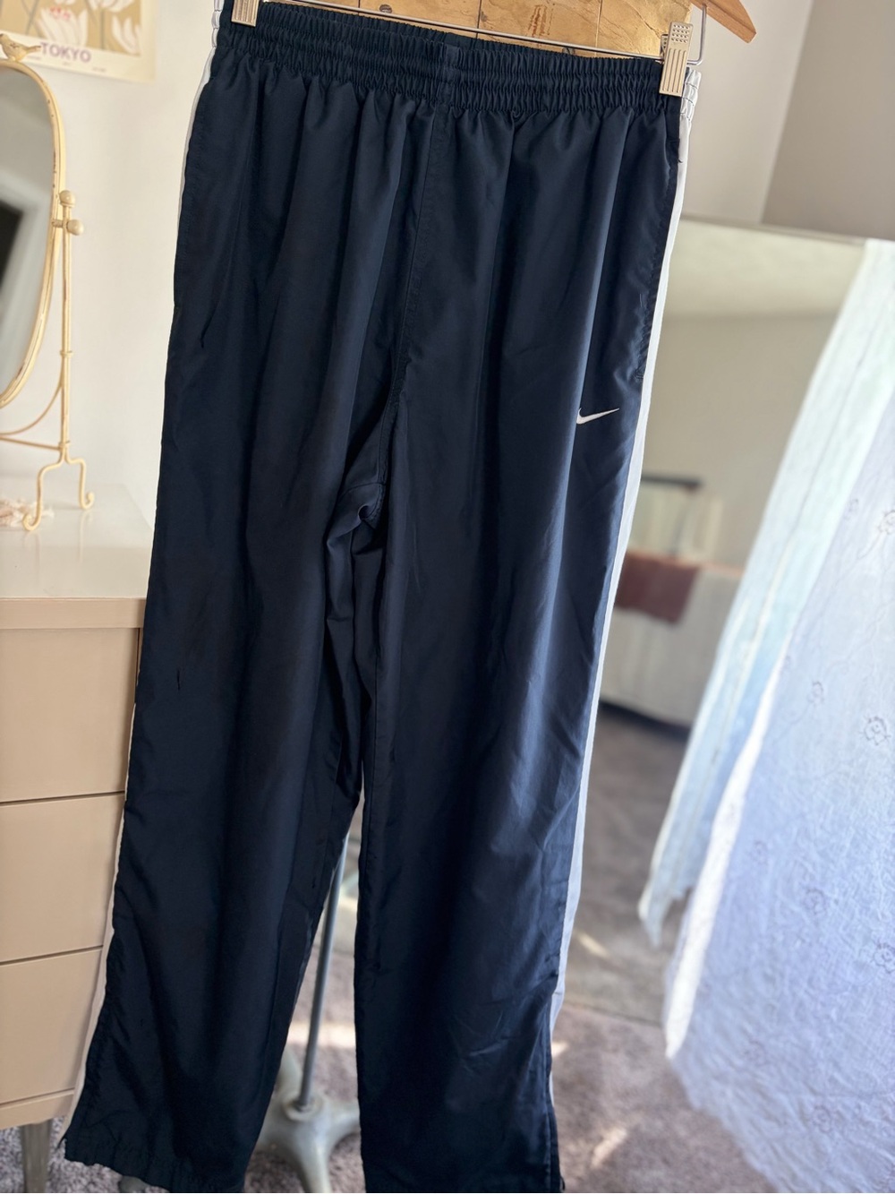 Nike Black Track Pants with White Side Stripe and Zippered Bottom